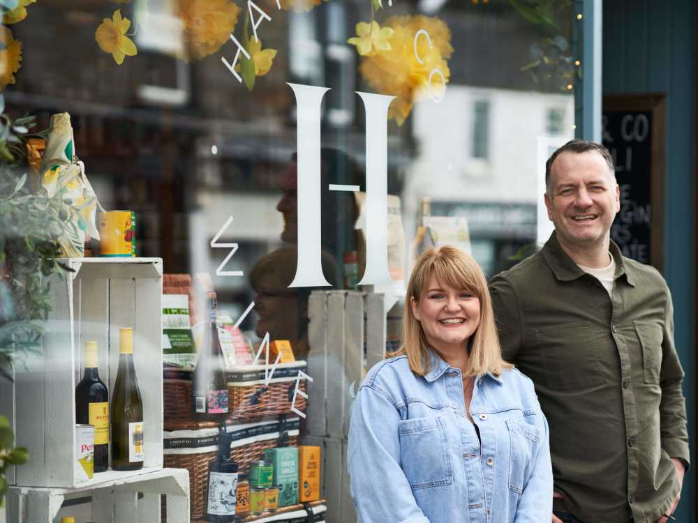 The owners of Harris & Co stand outside their shop.