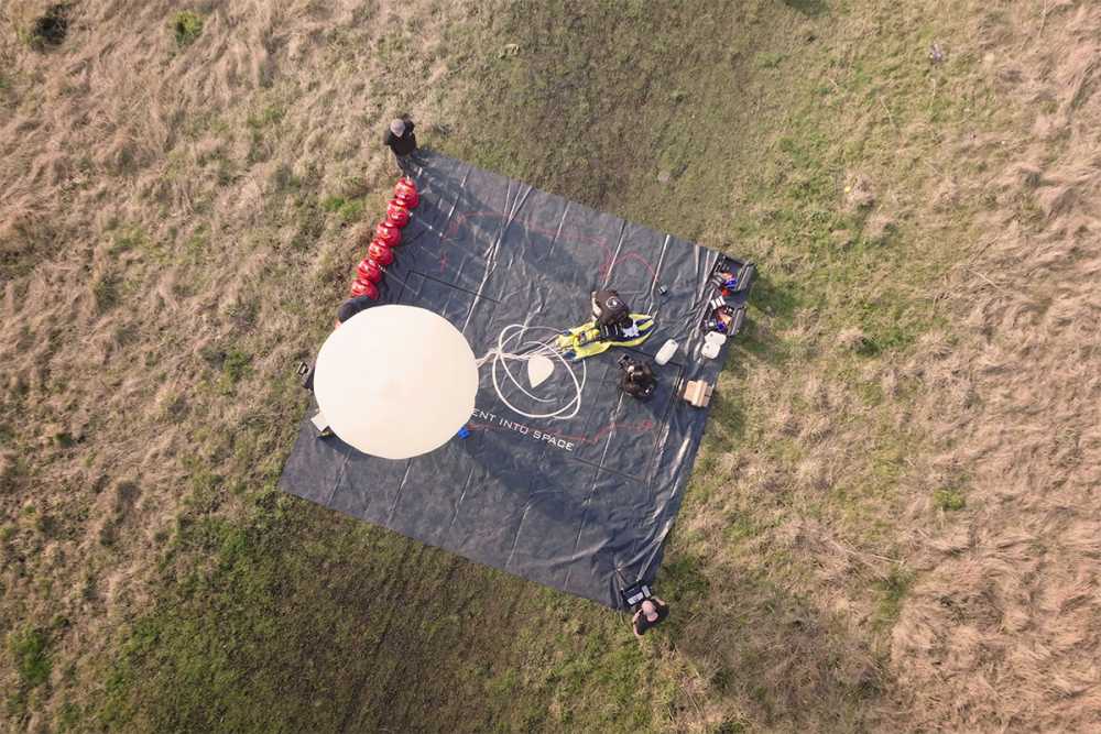 A launchpad with a hydrogen balloon being inflated.
