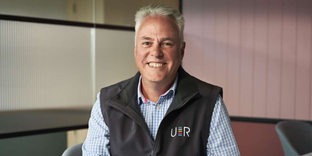 Photo of Clive Steed smiling into camera.