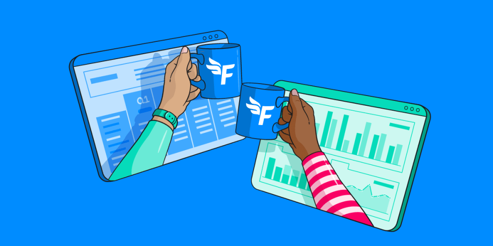 Two people clinking mugs in front a screen